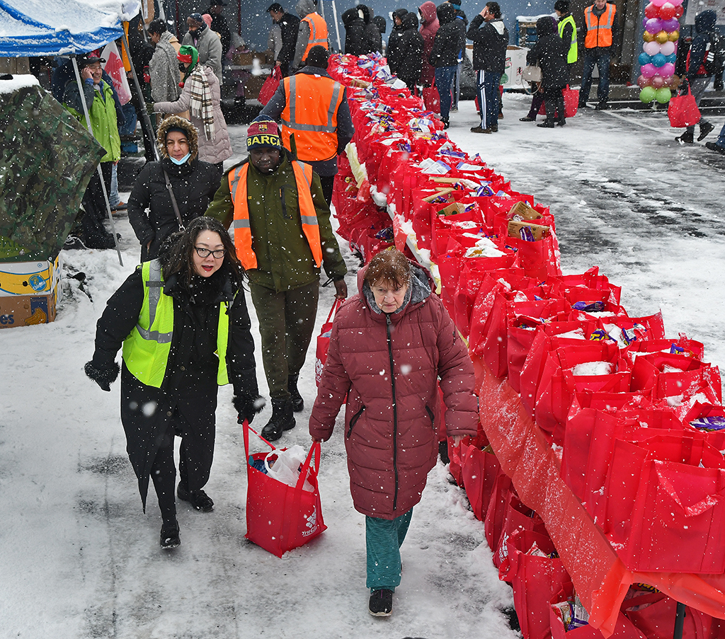 Syracuse food pantry, volunteers distribute 100s of boxes to New American families